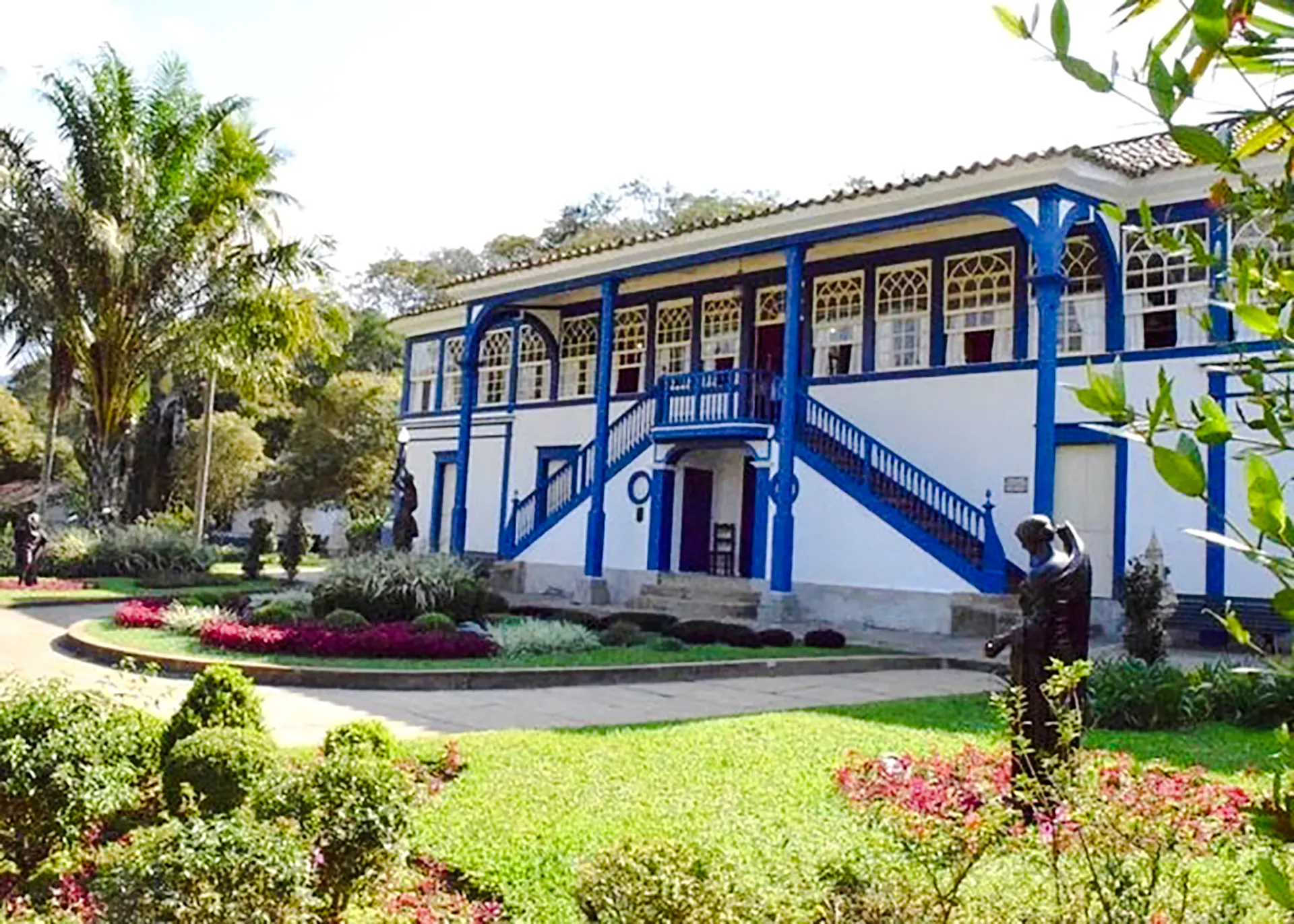 Historic plantation house with blue accents in Coffee Valley, Rio de Janeiro.