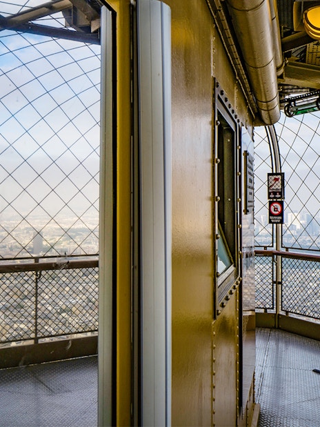 Eiffel Tower observation deck view with telescope, Paris.