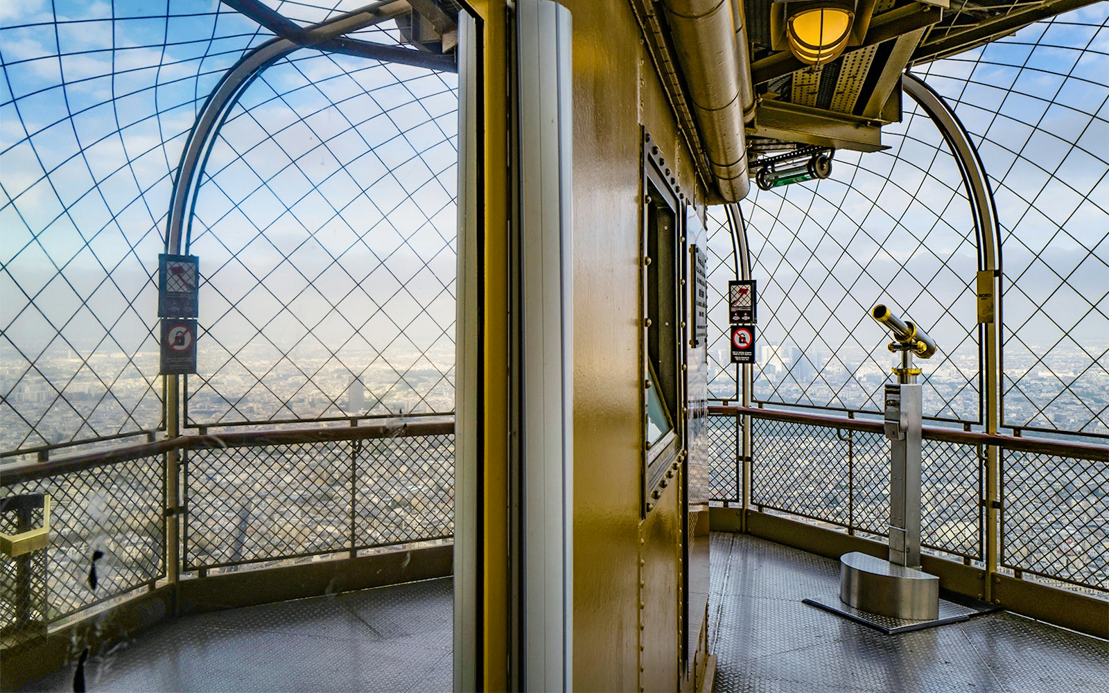 Eiffel Tower observation deck view with telescope, Paris.