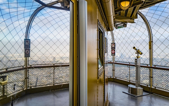 Eiffel Tower observation deck view with telescope, Paris.