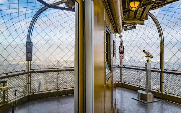 Eiffel Tower observation deck view with telescope, Paris.