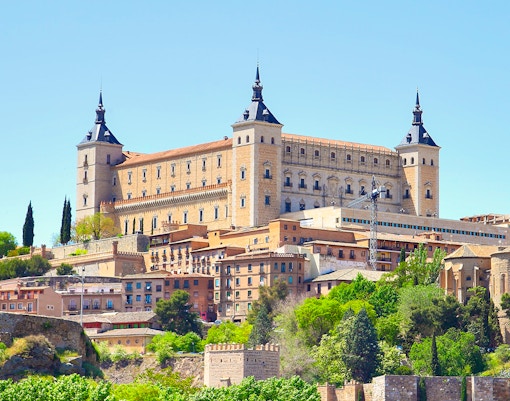 Alcazar fortress in Toledo, Spain, overlooking the cityscape with historic architecture.