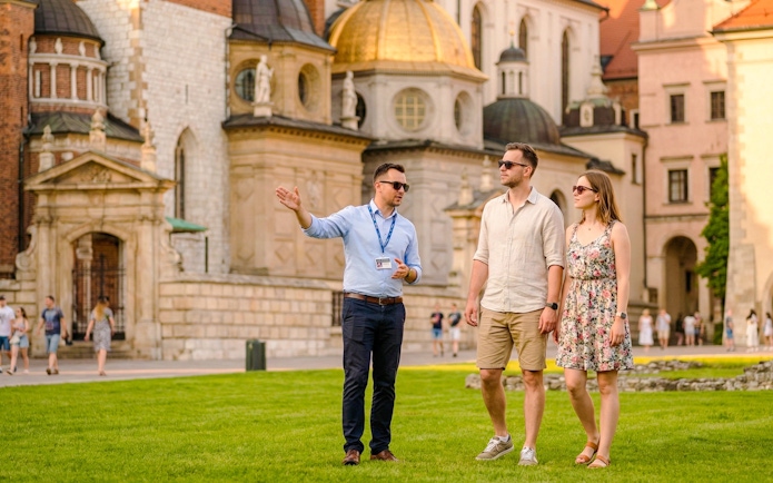 Guide leading guests at Wawel Castle in Krakow, Poland.