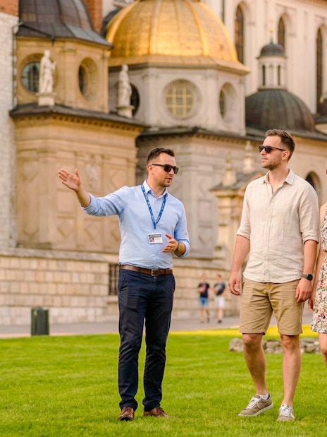 Guide leading guests at Wawel Castle in Krakow, Poland.