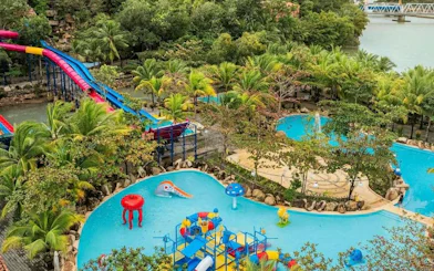 Water park with colorful slides and pools near Cai River, Dubai.
