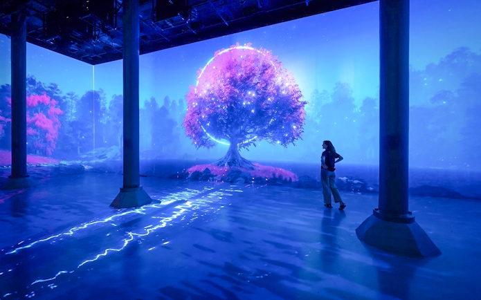 Guests viewing digital art installation at ARTECHOUSE New York.