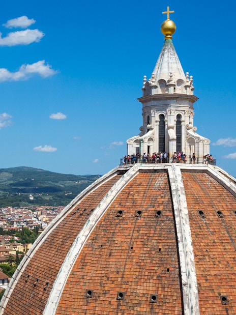 Brunelleschi's dome atop Florence Cathedral with cityscape in the background.