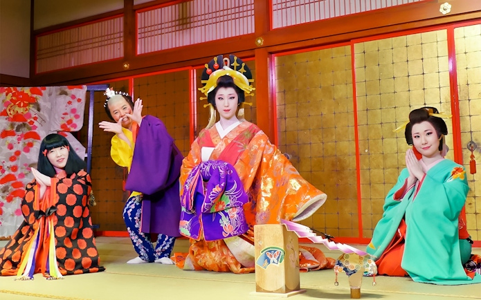 Performers in traditional Japanese attire at Noboribetsu Date Jidaimura.