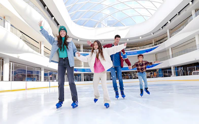 Family ice skating at the American Dream ice rink.