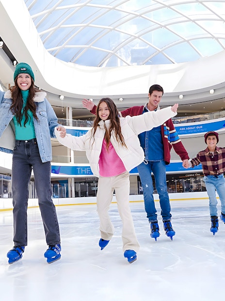 Family ice skating at the American Dream ice rink.