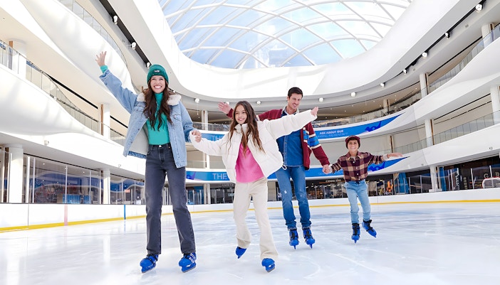 Family ice skating at the American Dream ice rink.