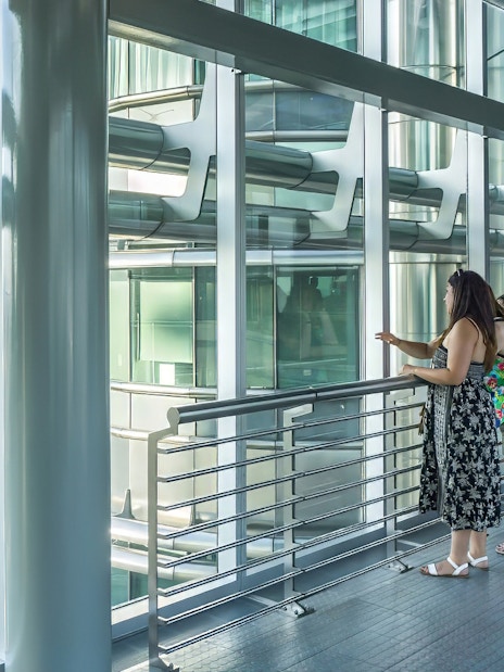 Visitors observing the Petronas Twin Towers from the sky bridge in Kuala Lumpur.