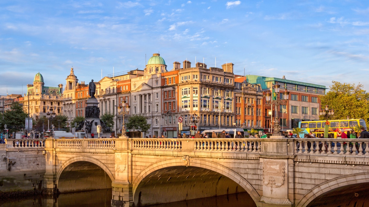 O'Connell Bridge in Dublin with historic buildings and a double-decker bus.