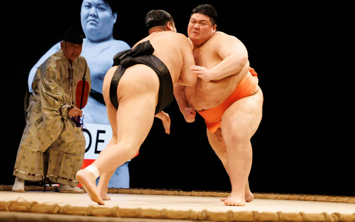 Sumo wrestlers competing at Sumo Hall Hirakuza Osaka.