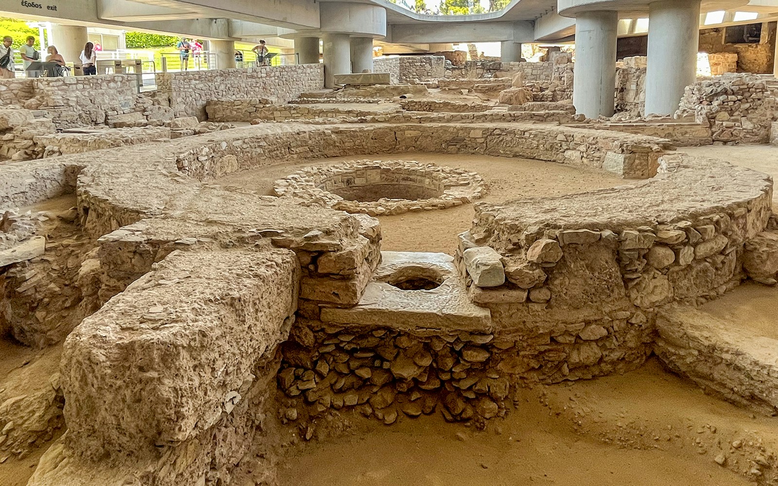 Excavation site at the Acropolis Museum, Athens, showcasing ancient artifacts and ruins.