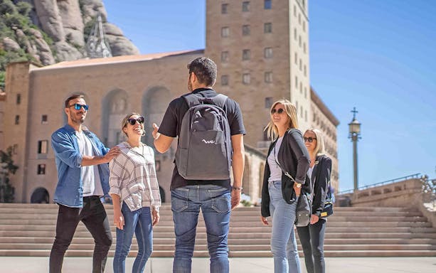 Group tour with guide at Montserrat Monastery, Spain.