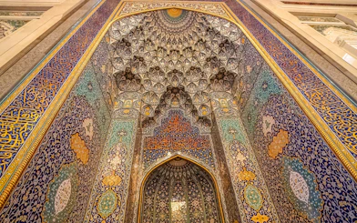 Mihrab with intricate tilework in Sultan Qaboos Grand Mosque, Oman.