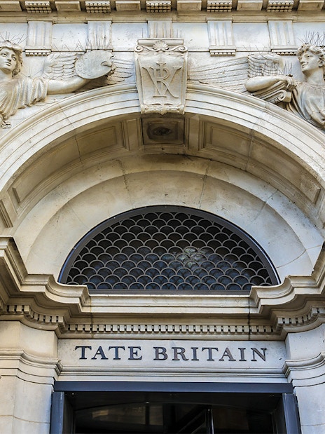Tate Britain entrance with classical sculptures, London.