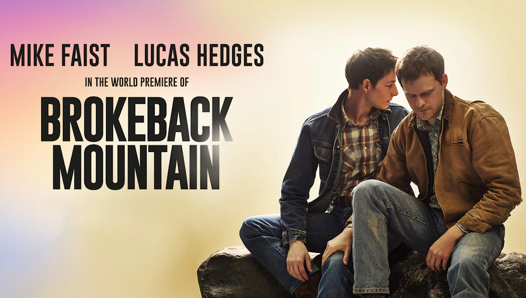World premiere poster of Brokeback Mountain with two men sitting on a rock.
