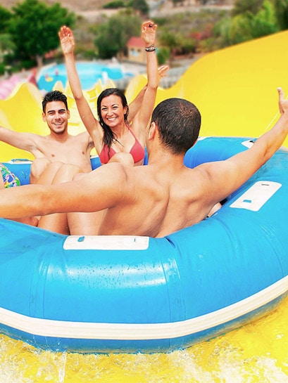 Visitors enjoying a water slide ride at Aqualand Maspalomas.