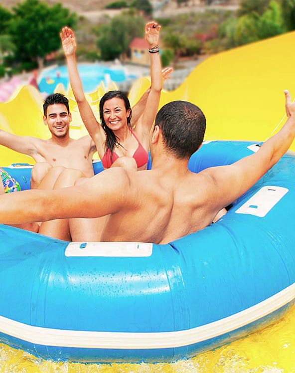Visitors enjoying a water slide ride at Aqualand Maspalomas.