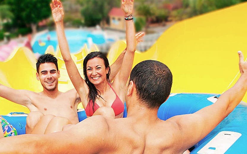 Visitors enjoying a water slide ride at Aqualand Maspalomas.