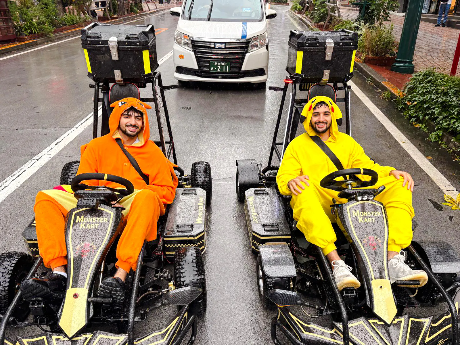 Tourists in character costumes driving go-karts on a Tokyo street during Asakusa Electric Go Kart 90 min Tour.