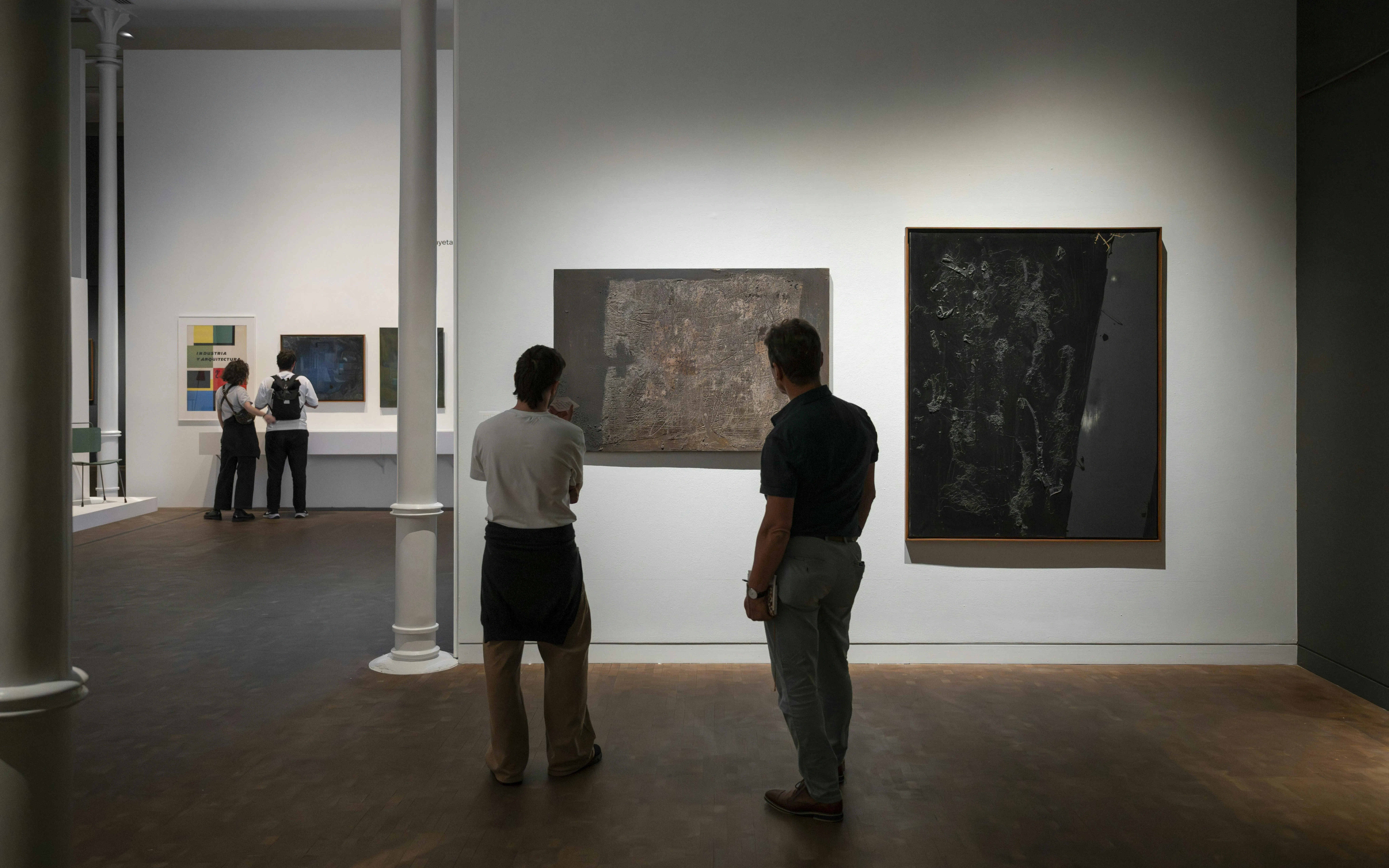 Visitors observing abstract art at Museu Tàpies, Barcelona.