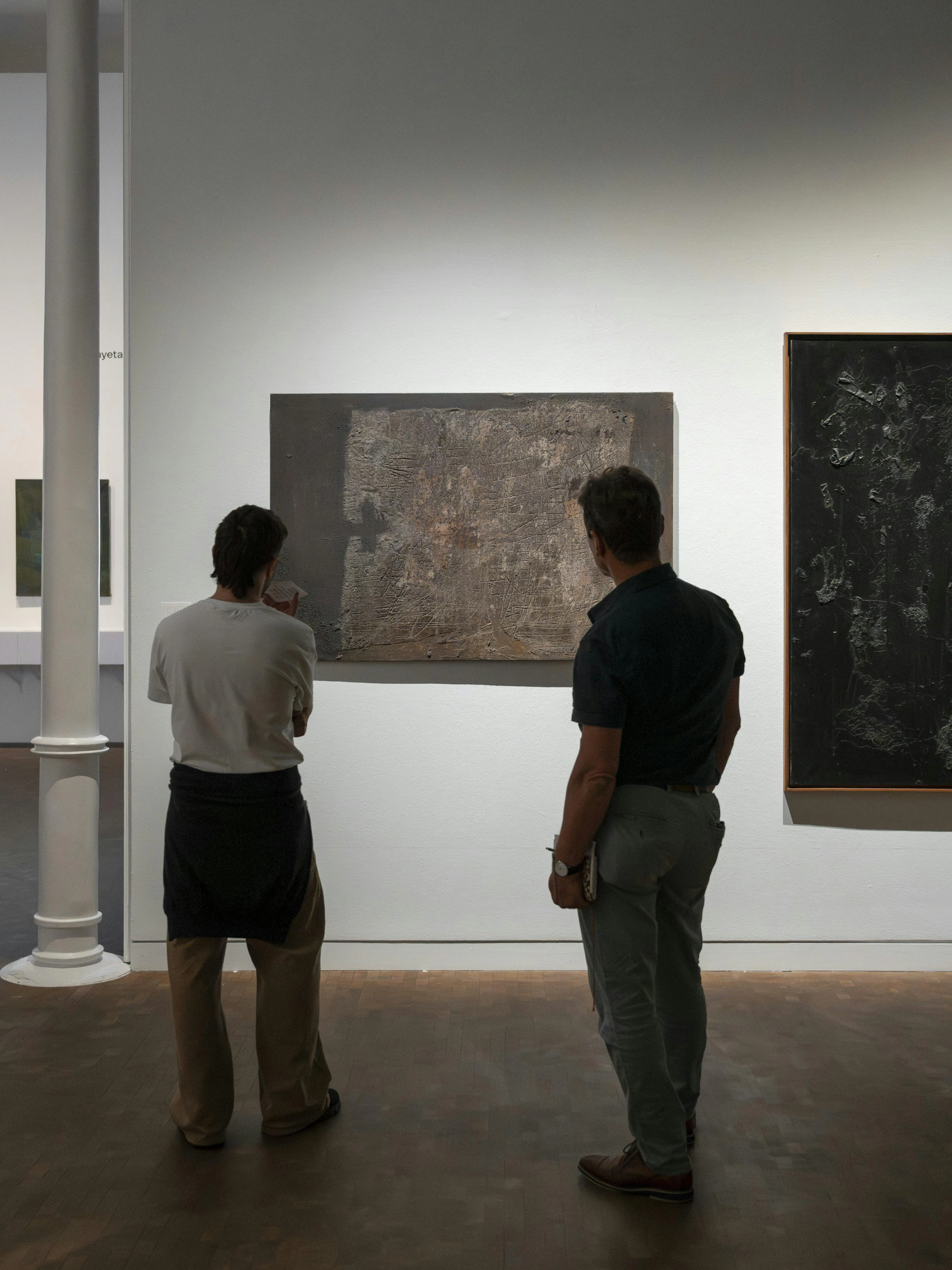 Visitors observing abstract art at Museu Tàpies, Barcelona.