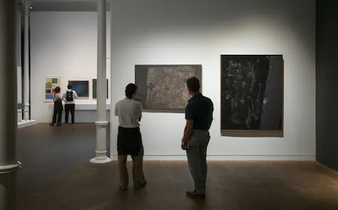 Visitors observing abstract art at Museu Tàpies, Barcelona.