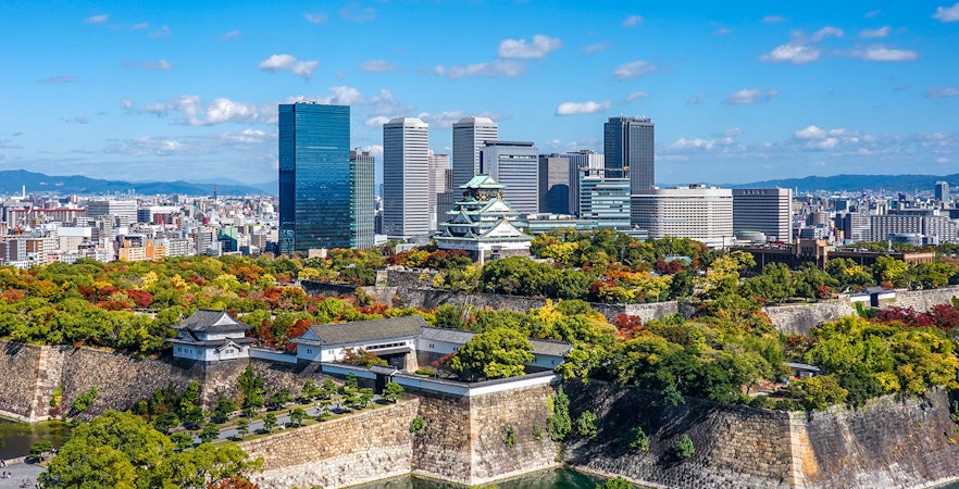 Osaka Castle Tower with Osaka Business Park skyscrapers in the background.