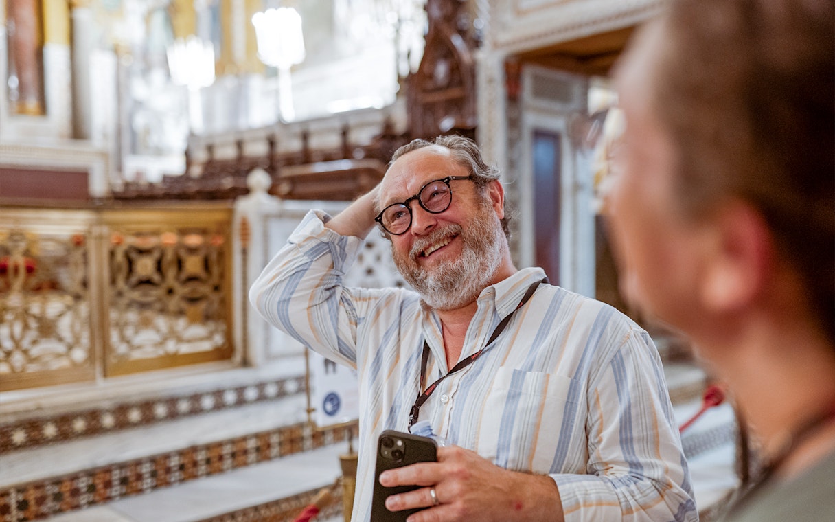Man enjoying a guided tour inside Palazzo Dei Normanni, Palermo.