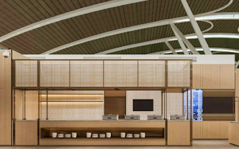 Modern dining area at Shanghai Pudong International Airport with wooden decor and buffet setup.