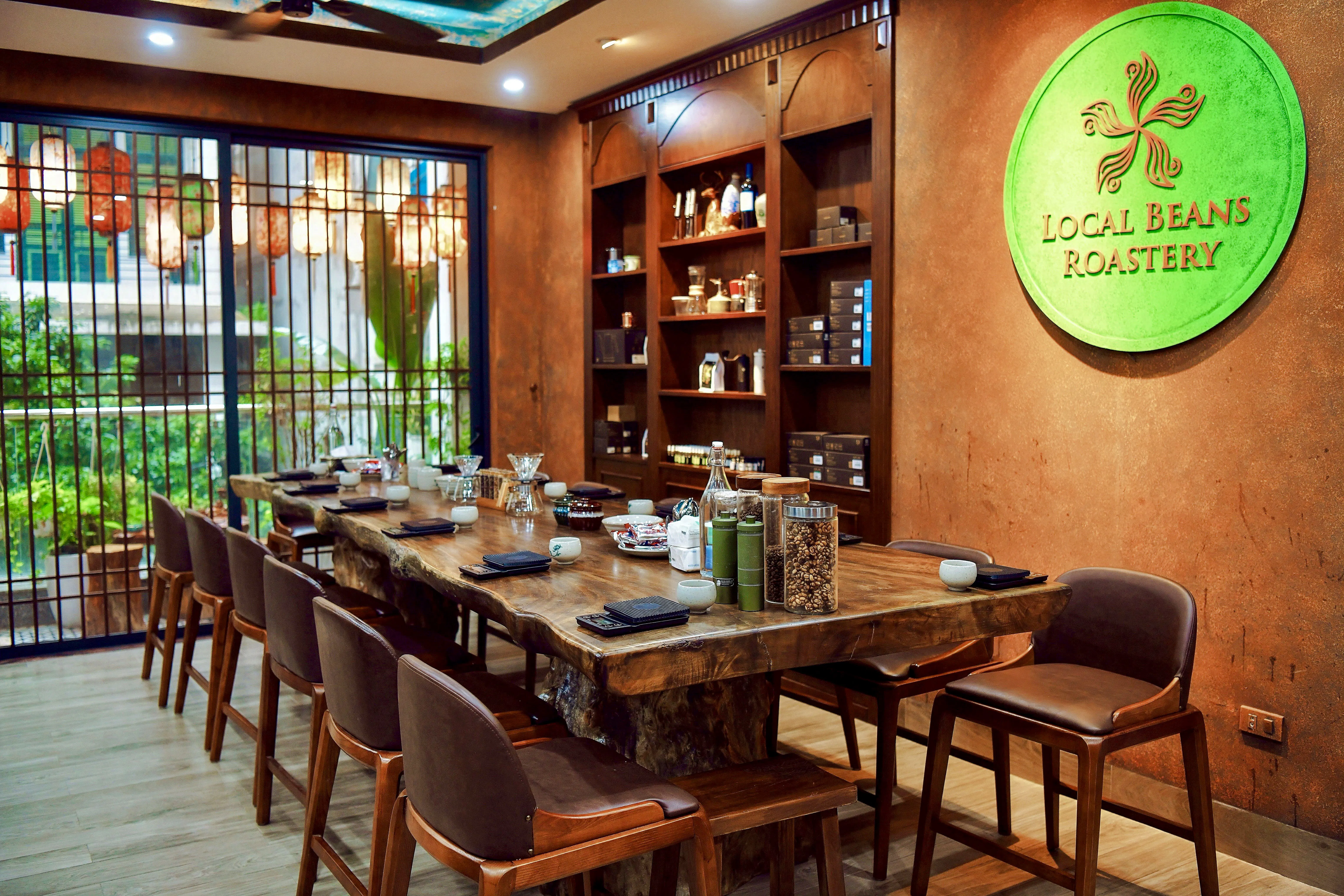 Hanoi coffee workshop with wooden table set for tasting egg, coconut, and salt coffee.