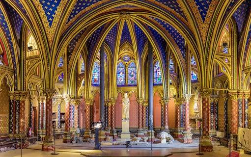 Lower Chapels in Sainte Chapelle with colorful stained glass and ornate arches, Paris, France.