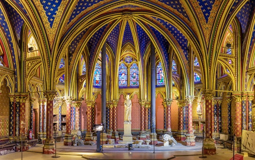 Lower Chapels in Sainte Chapelle with colorful stained glass and ornate arches, Paris, France.