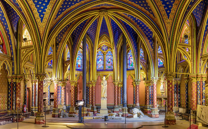 Lower Chapels in Sainte Chapelle with colorful stained glass and ornate arches, Paris, France.