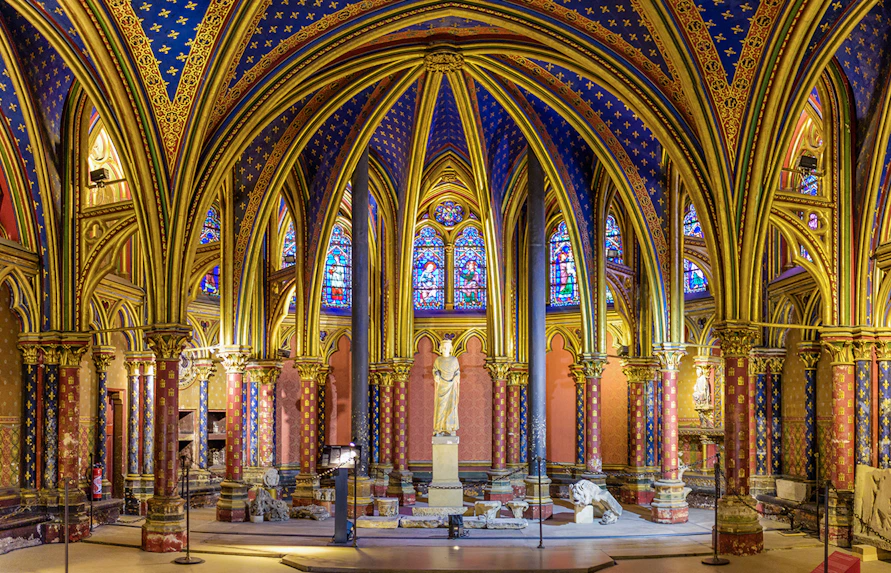 Lower Chapels in Sainte Chapelle with colorful stained glass and ornate arches, Paris, France.