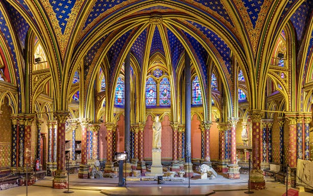 Lower Chapels in Sainte Chapelle with colorful stained glass and ornate arches, Paris, France.