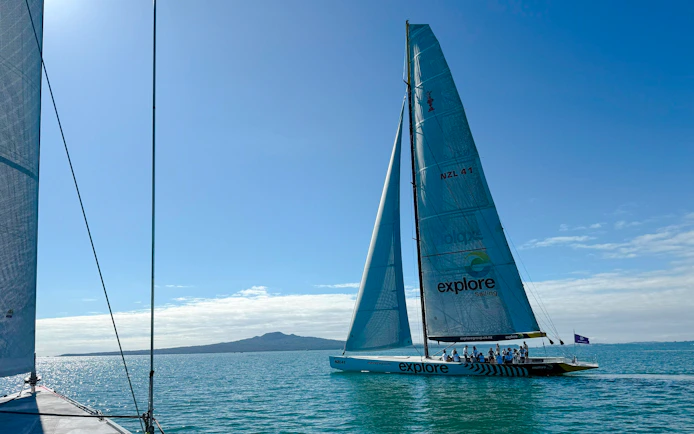 Sailing yacht on Auckland's Waitemata Harbour during America's Cup experience.