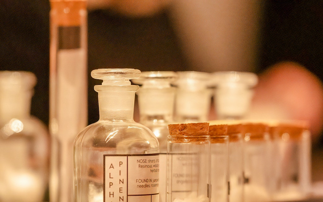 Glass bottles with labels for a London Dry gin tasting experience.
