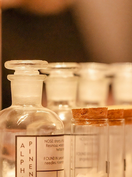 Glass bottles with labels for a London Dry gin tasting experience.