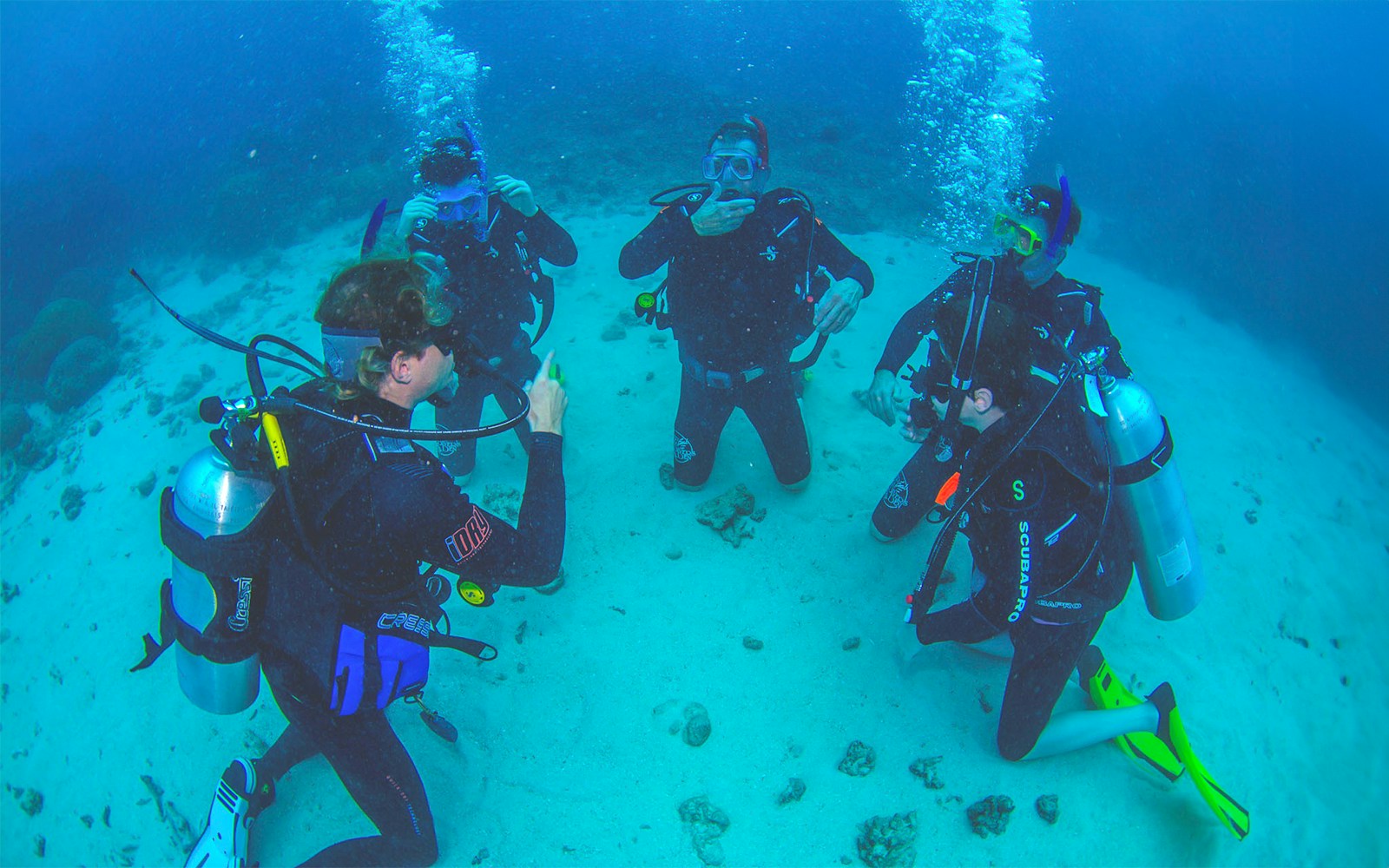 Tourists scuba diving at the Outer Great Barrier Reef near Cairns.