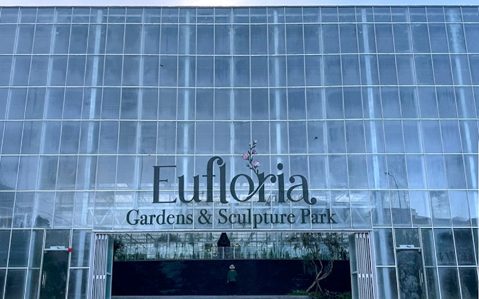 Eufloria Gardens & Sculpture Park entrance with glass facade.