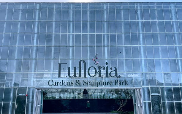 Eufloria Gardens & Sculpture Park entrance with glass facade.