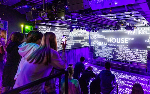 Visitors viewing digital displays at Our House Museum of Electronic Dance Music.