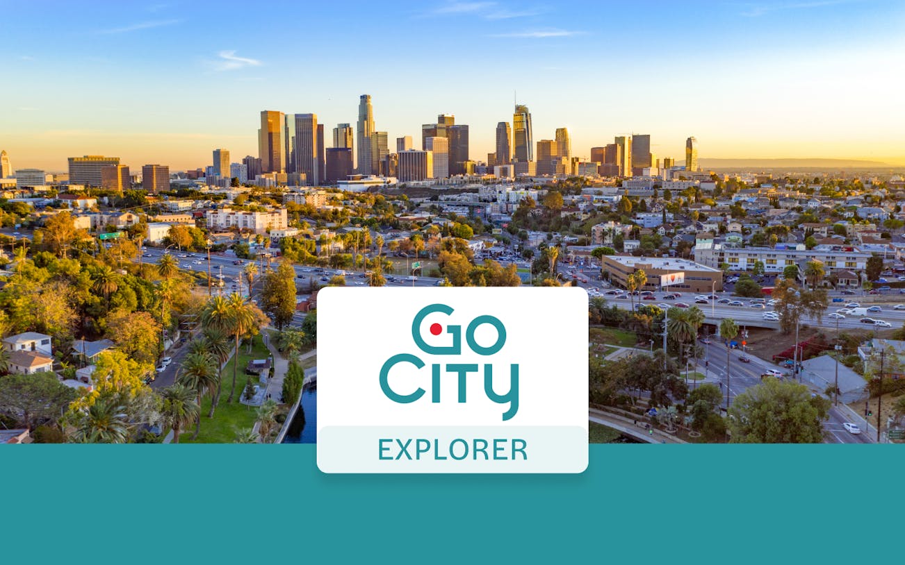 Los Angeles skyline at sunset with Go City Explorer Pass logo.