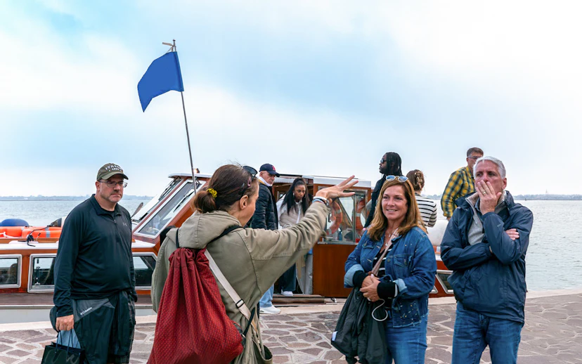 Tourists boarding a private boat for Murano and Burano Islands tour.