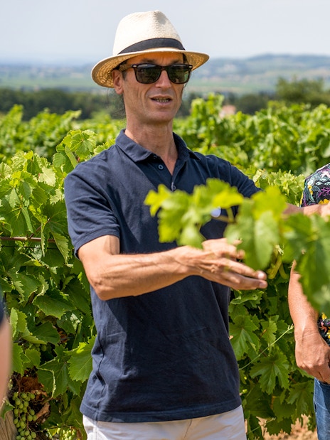 Men exploring vineyards in Chateauneuf du Pape, Avignon, France.