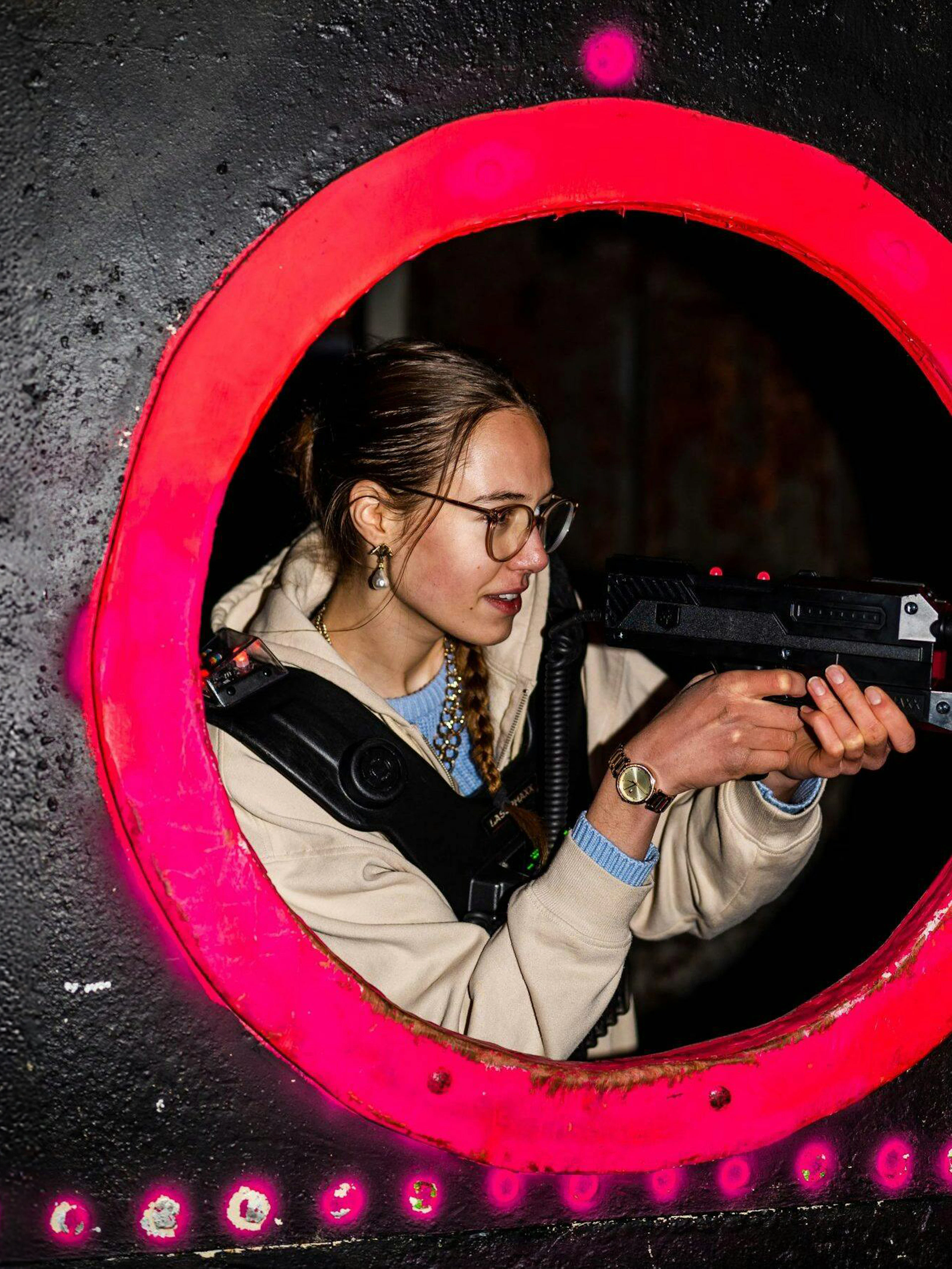 Person playing laser tag in Rotterdam arena.